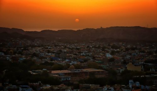 High angle view of townscape against sky during sunset