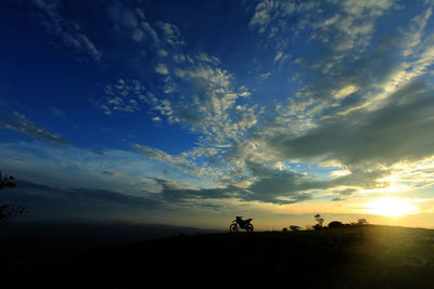 Scenic view of silhouette land against sky during sunset