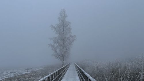 Bridge over river against clear sky