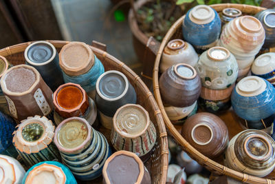 High angle view of various cups in baskets at market