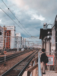 Train on railroad station against sky