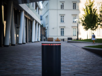 Close-up of bollard at building