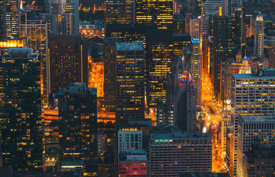 Illuminated buildings in city at night