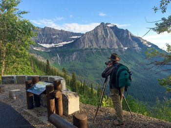 Rear view of man standing on mountain