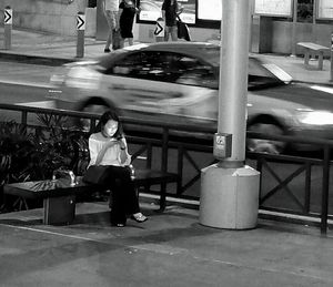 Woman standing in city