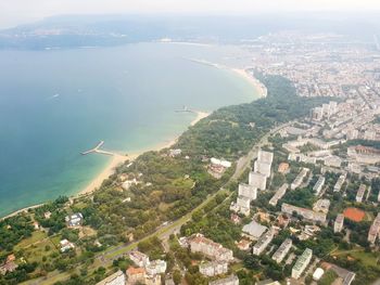 High angle view of buildings and sea in town