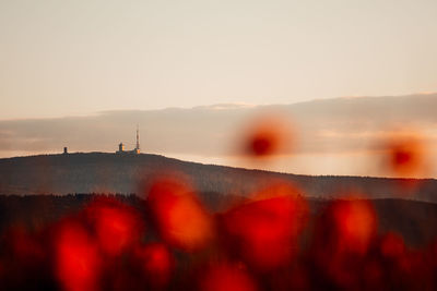 Scenic view of land against sky during sunset