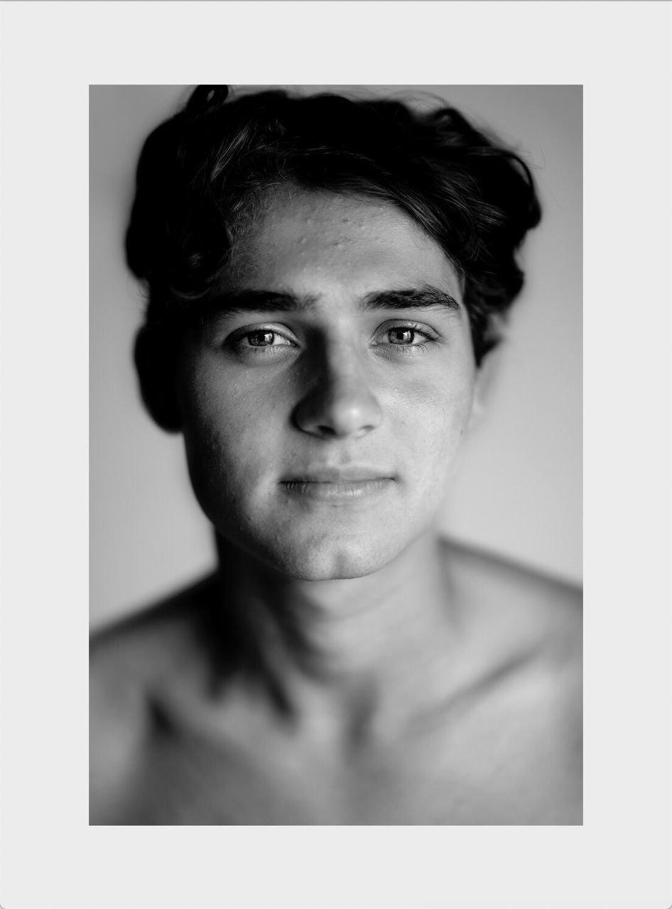 portrait, one person, headshot, indoors, transfer print, young adult, front view, young men, close-up, looking at camera, auto post production filter, lifestyles, real people, human body part, studio shot, shirtless, beautiful people, body part, human face