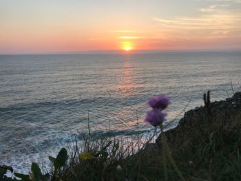 Scenic view of sea against sky during sunset