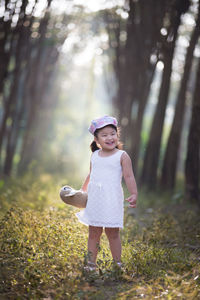 Full length of girl playing at park