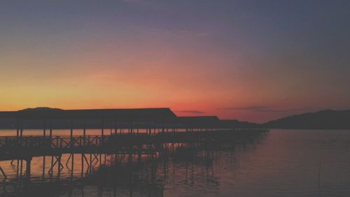 Scenic view of lake at sunset