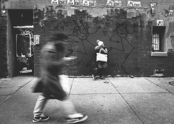 People walking on street in city