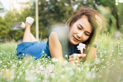 Woman resting on field