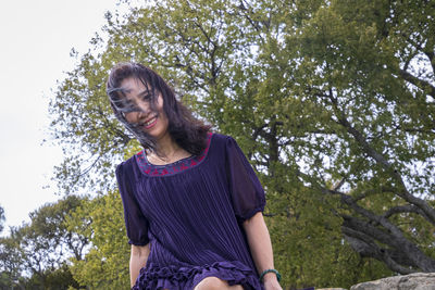 Portrait of a smiling young woman outdoors