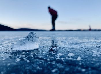 Surface level of frozen sea against sky