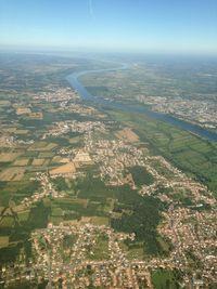 Aerial view of agricultural field against sky