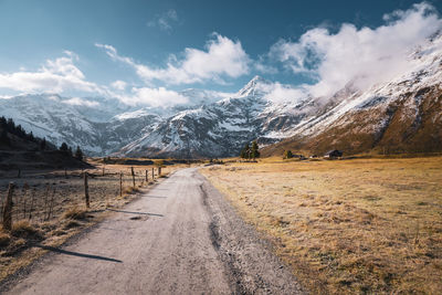 Snow capped mountains above fall colored highland in gastein, salzburg, austria