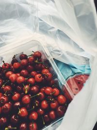 Close-up of red cherries in container