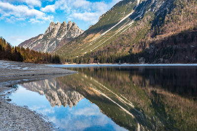 Scenic view of lake and mountains against sky