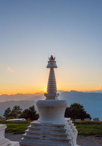 Traditional building against clear sky at sunset