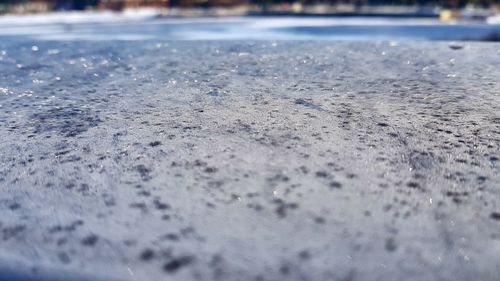 Surface level of snow against sky