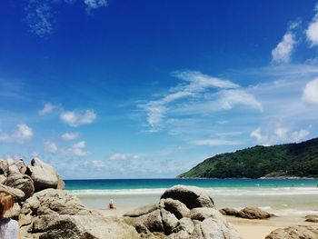 Scenic view of beach against blue sky