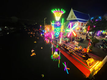 Illuminated multi colored lights on road at night