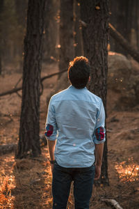 Rear view of man standing on field