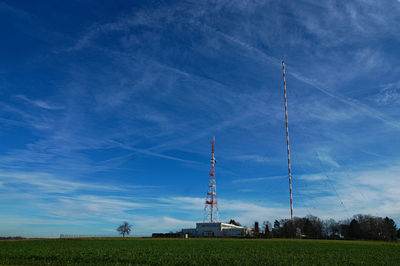 Low angle view of communications tower against sky