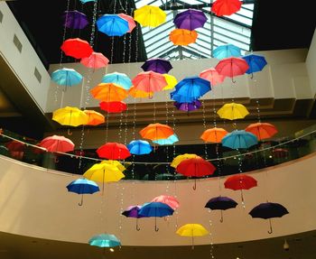 Low angle view of illuminated lanterns hanging over water