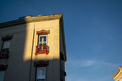 Low angle view of building against blue sky