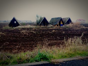 Houses on grassy field