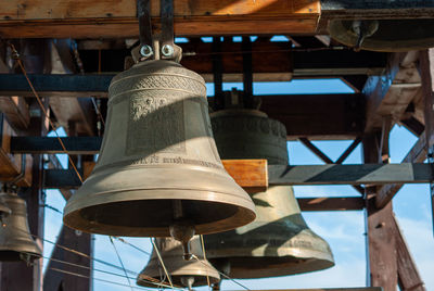 Traditional old bell in a church tower against blue sky