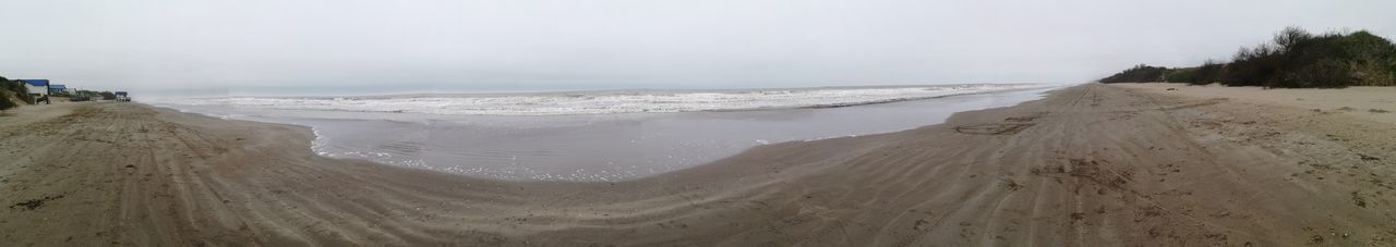 Panoramic view of beach against sky