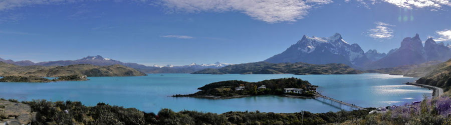 Panoramic view of sea and mountains against sky