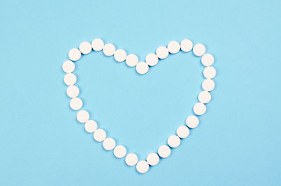 Close-up of heart shape against blue background