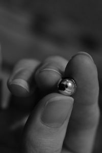 Close-up of human hand holding eyeglasses