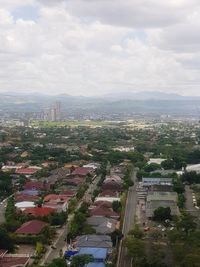 High angle view of buildings in city against sky