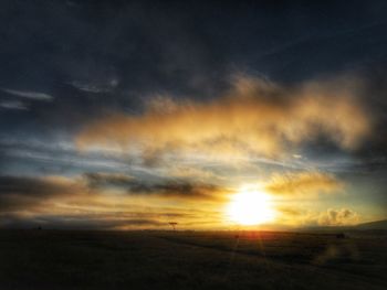 Scenic view of landscape at sunset