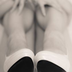 Close-up of shoes on tiled floor