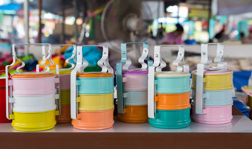 Close-up of multi colored bottles on table