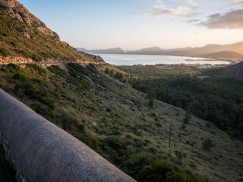 Scenic view of mountains and sea against sky