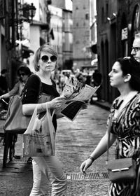 Friends walking on street in city
