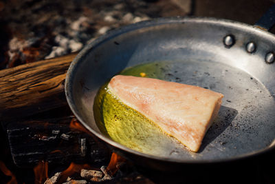 High angle view of meat in cooking pan