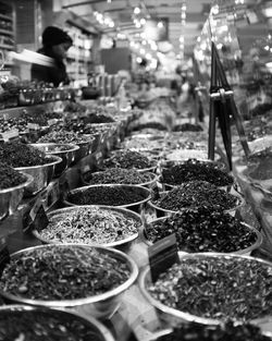 Various spices in containers for sale in shop