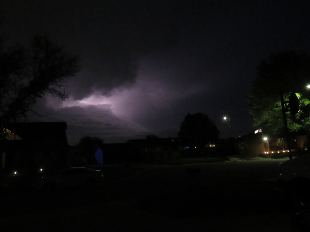 night, darkness, illuminated, sky, lightning, thunder, architecture, tree, light, midnight, cloud, storm, building exterior, nature, thunderstorm, dark, no people, silhouette, city, built structure, plant, outdoors, beauty in nature, street