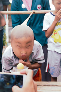 High angle view of people holding ice cream