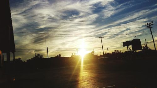 Electricity pylons at sunset