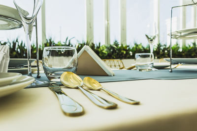 Close-up of wine glasses on table