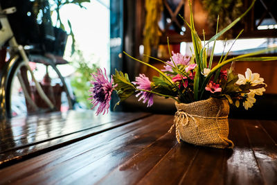 Close-up of flowering plants in basket on table